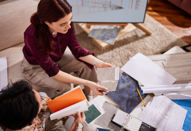 Interior designers working at a desk together